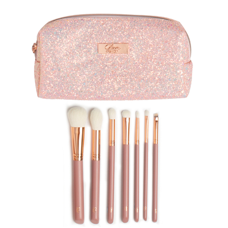 A set of seven brushes in a cosmetic bag